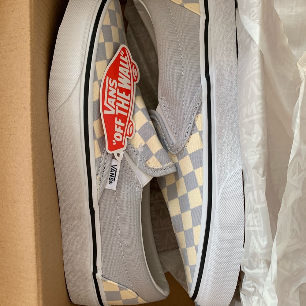 Checkered gray and white vans